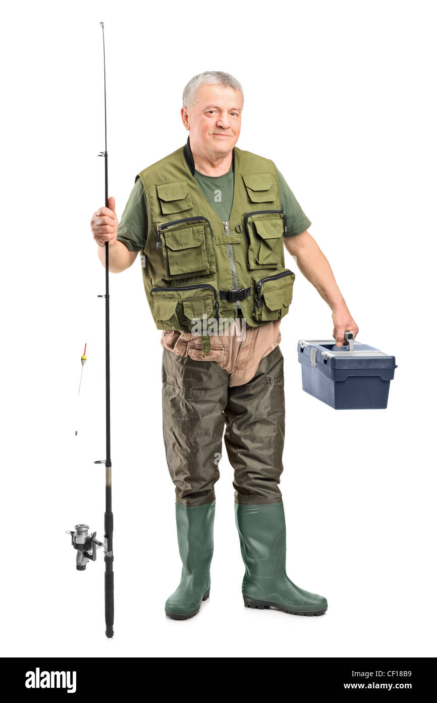 Full Length portrait of a young fisherman holding un équipement de pêche isolé sur fond blanc Banque D'Images