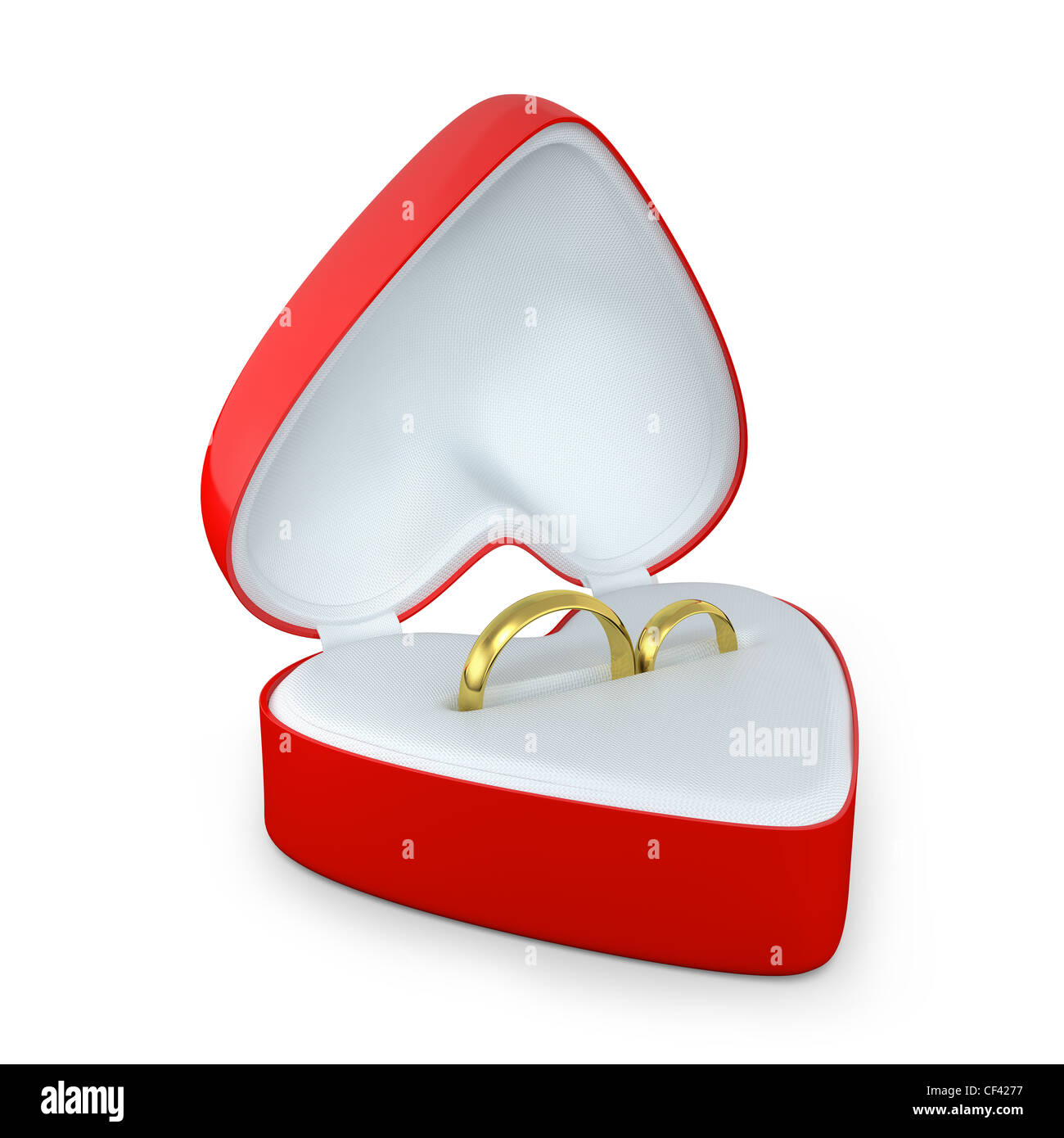 Paire de bagues de mariage dans une boîte en forme de coeur isolé sur fond blanc Banque D'Images