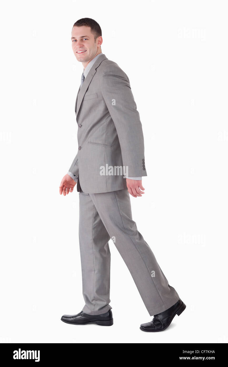 Portrait of a smiling businessman walking Banque D'Images