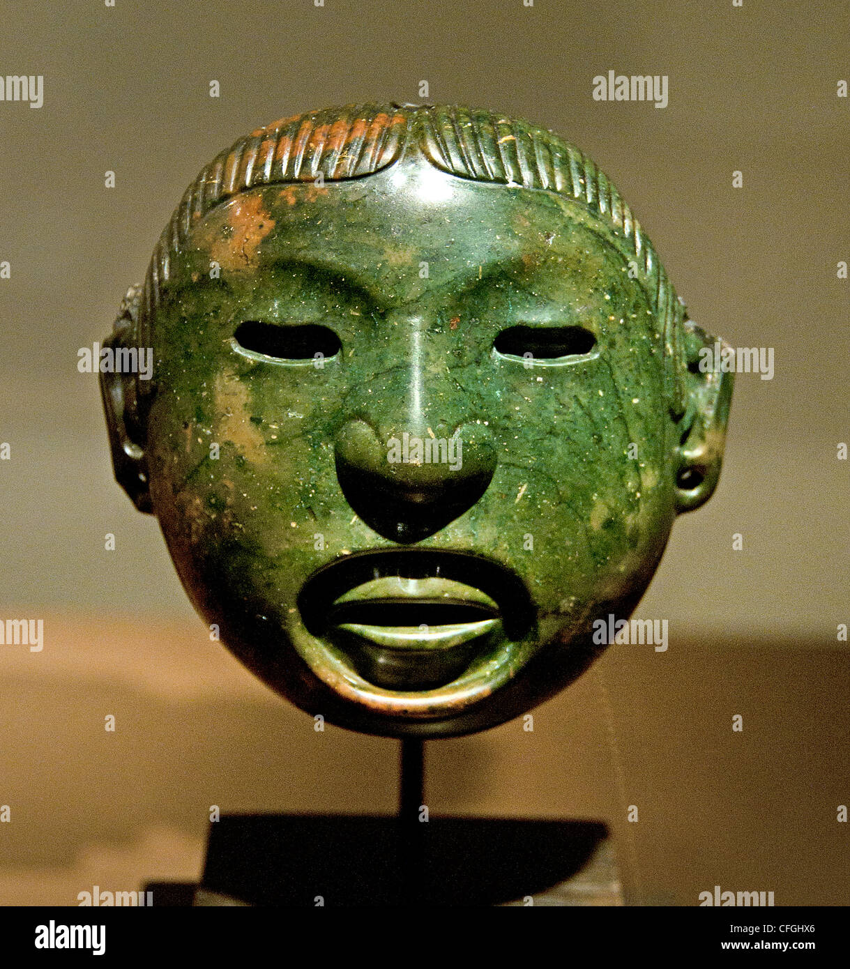 Masque pendentif dieu aztèque Xipe Totec rituels Vallée du Mexique Mexique Banque D'Images