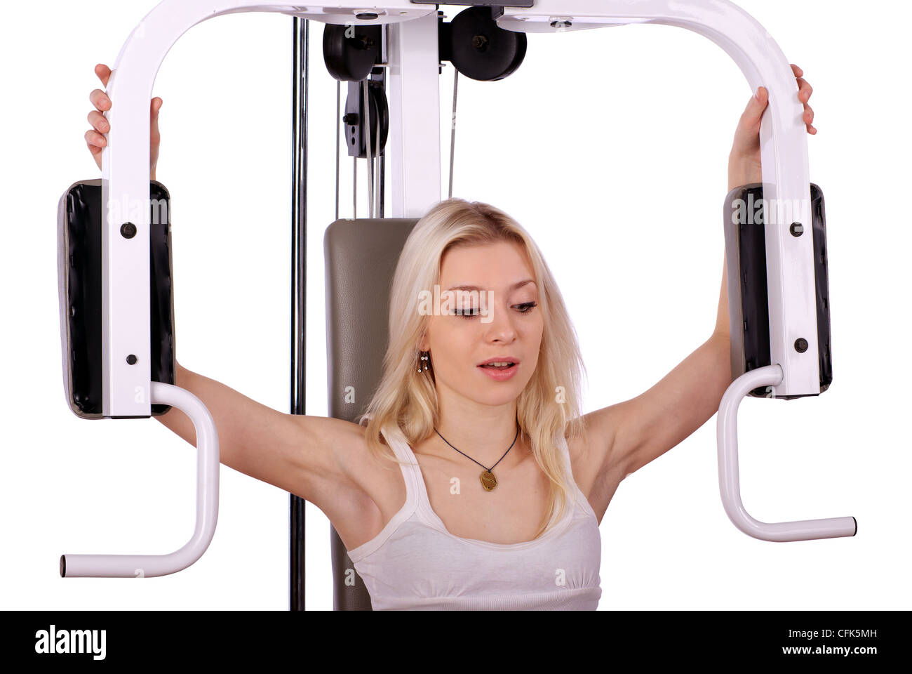 Jeune femme blonde faire la formation de muscle dans la salle de sport, isolé sur fond blanc Banque D'Images