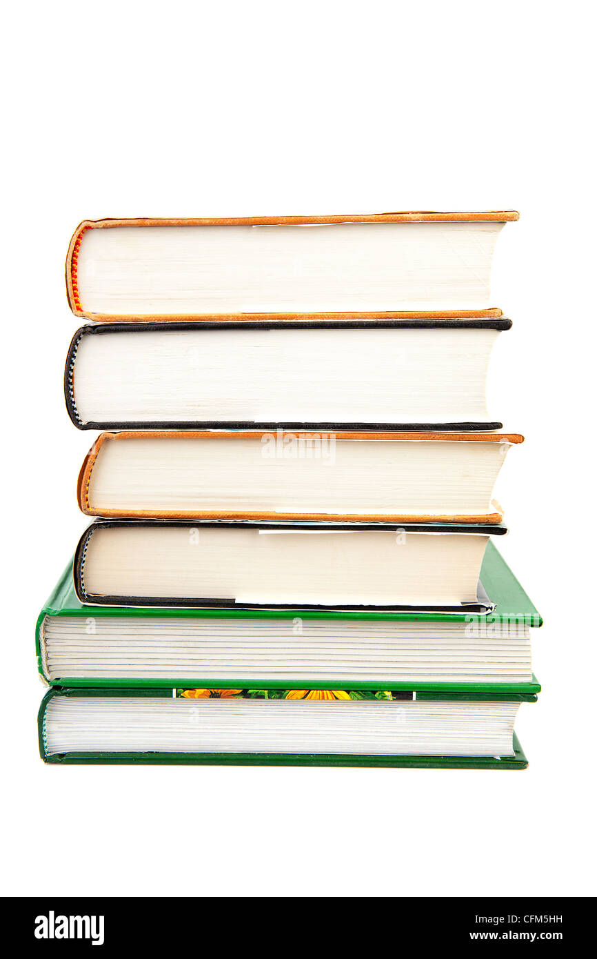 Six livres empilés sur fond blanc Banque D'Images