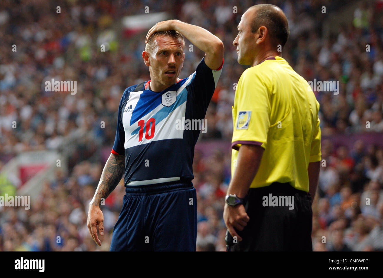 CRAIG BELLAMY SE PLAINT À LA Grande-bretagne V SÉNÉGAL Old Trafford Manchester en Angleterre le 26 juillet 2012 Banque D'Images