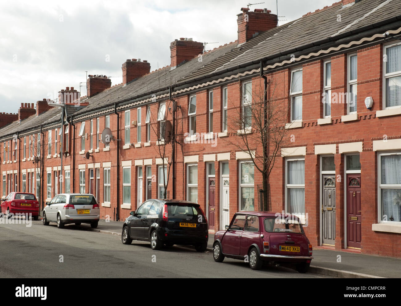 Logement en terrasse dans le quartier de Moss Side de Manchester. Banque D'Images