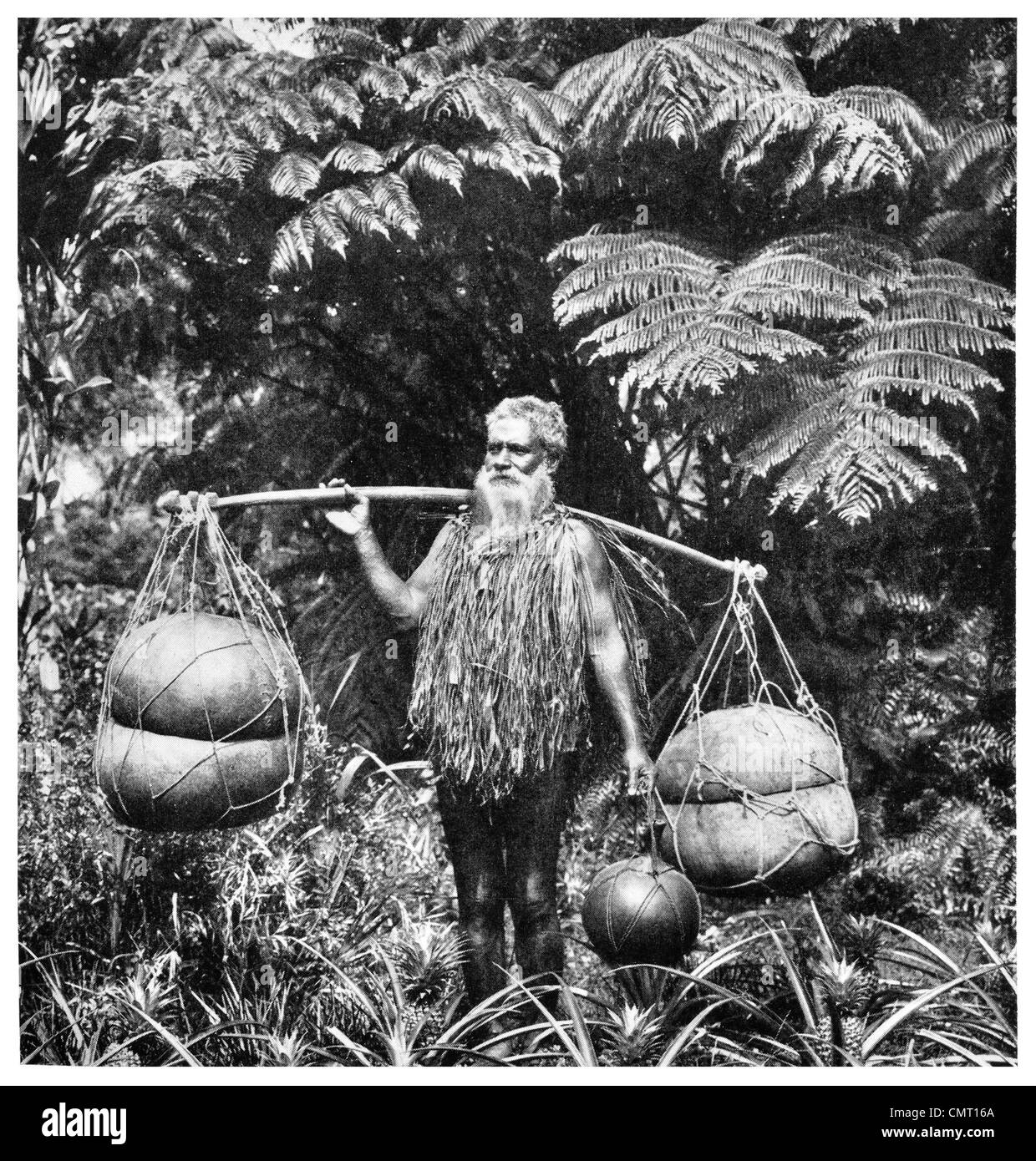1924 Hawaiian calebasse porteur d'eau Banque D'Images