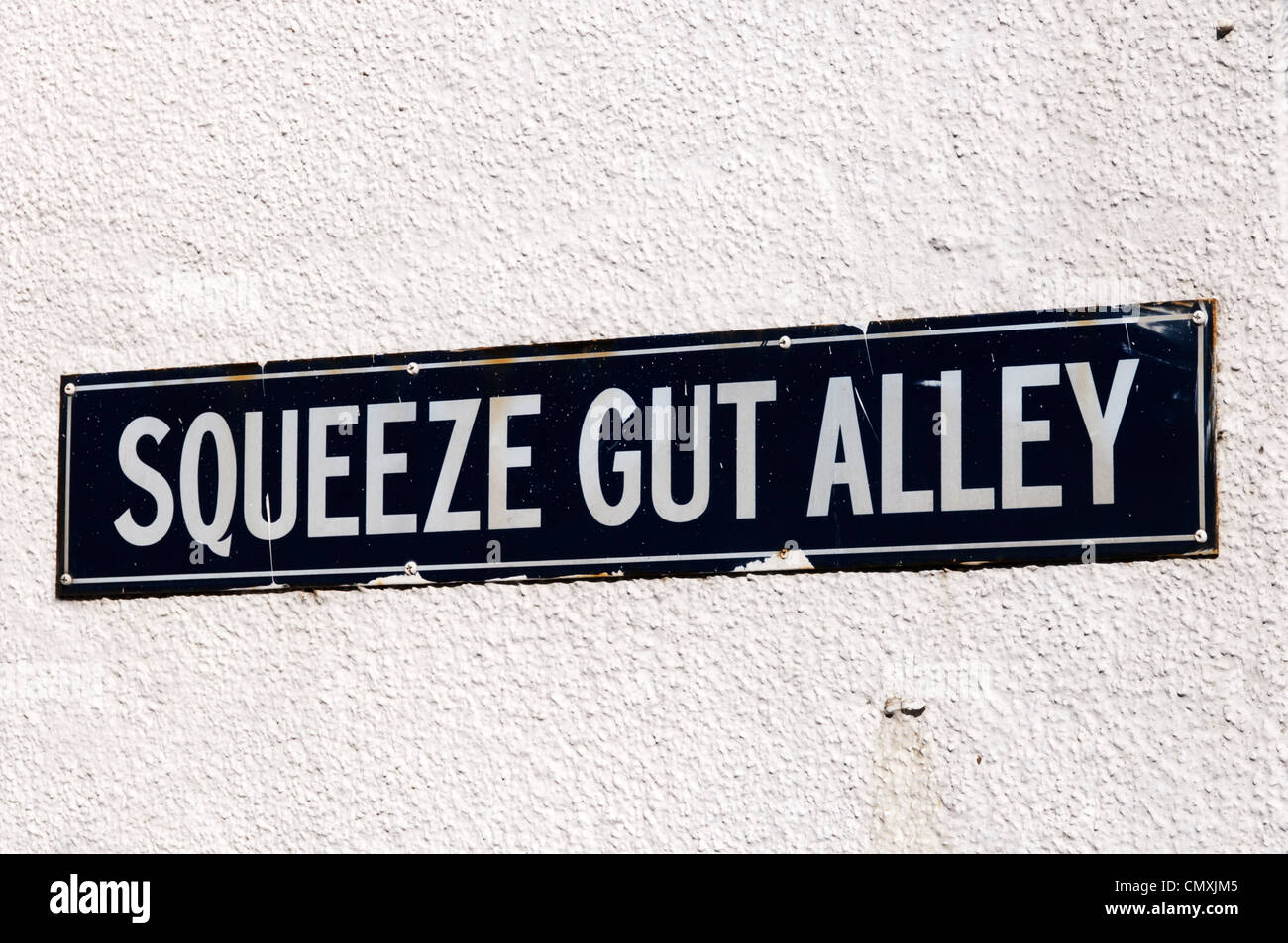 Le nom de rue signe pour Squeeze Gut Ruelle de Whitstable, Kent. Banque D'Images