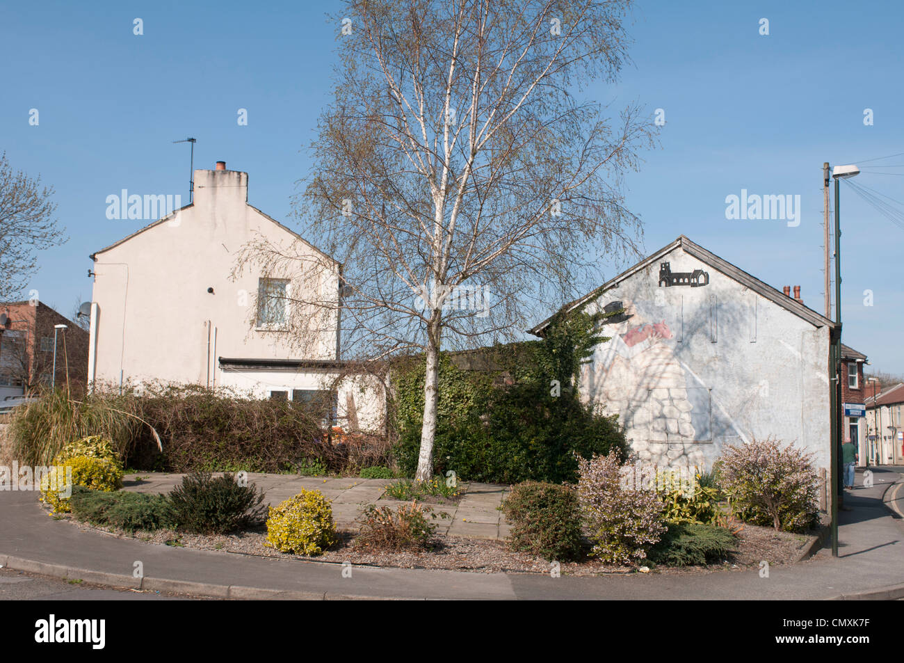 L'homme avec le cochon sur le mur, Kippax (M. Kershaw) Banque D'Images