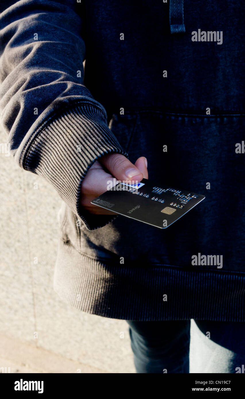 Carte de paiement offre adolescent Banque D'Images