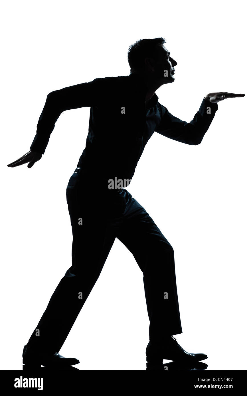 Un homme de race blanche de style égyptien drôle pleine longueur marche silhouette en studio isolé sur fond blanc Banque D'Images