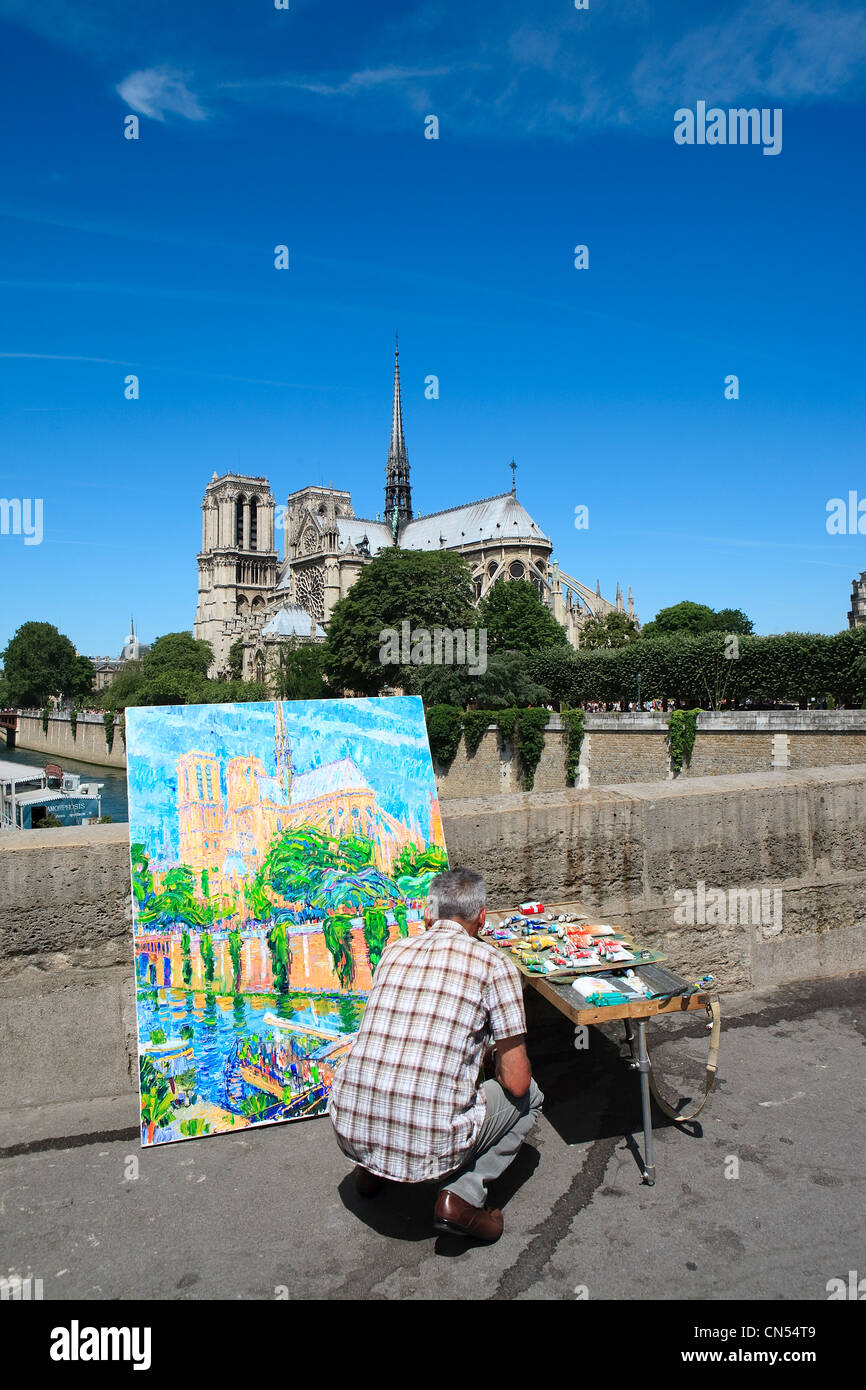 France, Paris, les rives de la rivière Seine inscrite au Patrimoine Mondial de l'UNESCO, peintre sur le Pont de l'Archeveche et Notre-Dame Banque D'Images