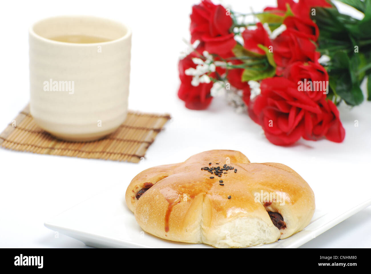 Le pain, le thé chinois et rose Banque D'Images