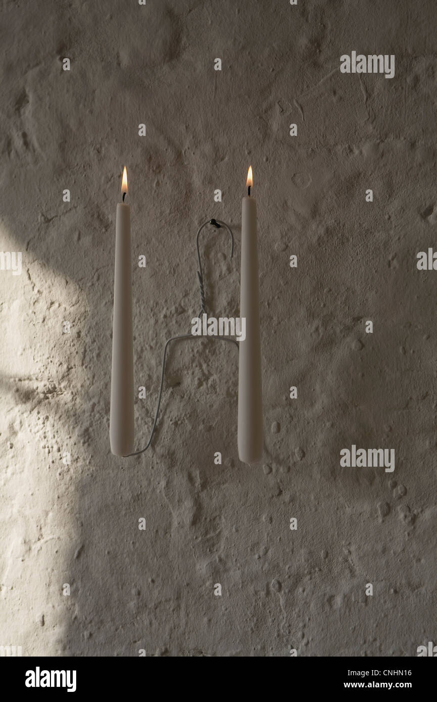 Bougies allumées sur un cintre Banque D'Images