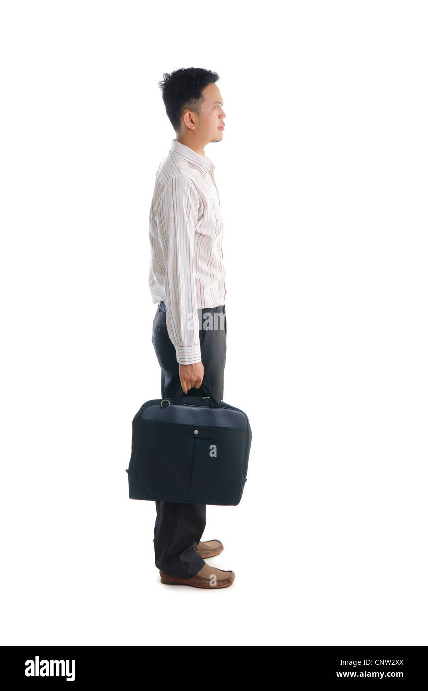Côté asiatique holding briefcase Banque D'Images