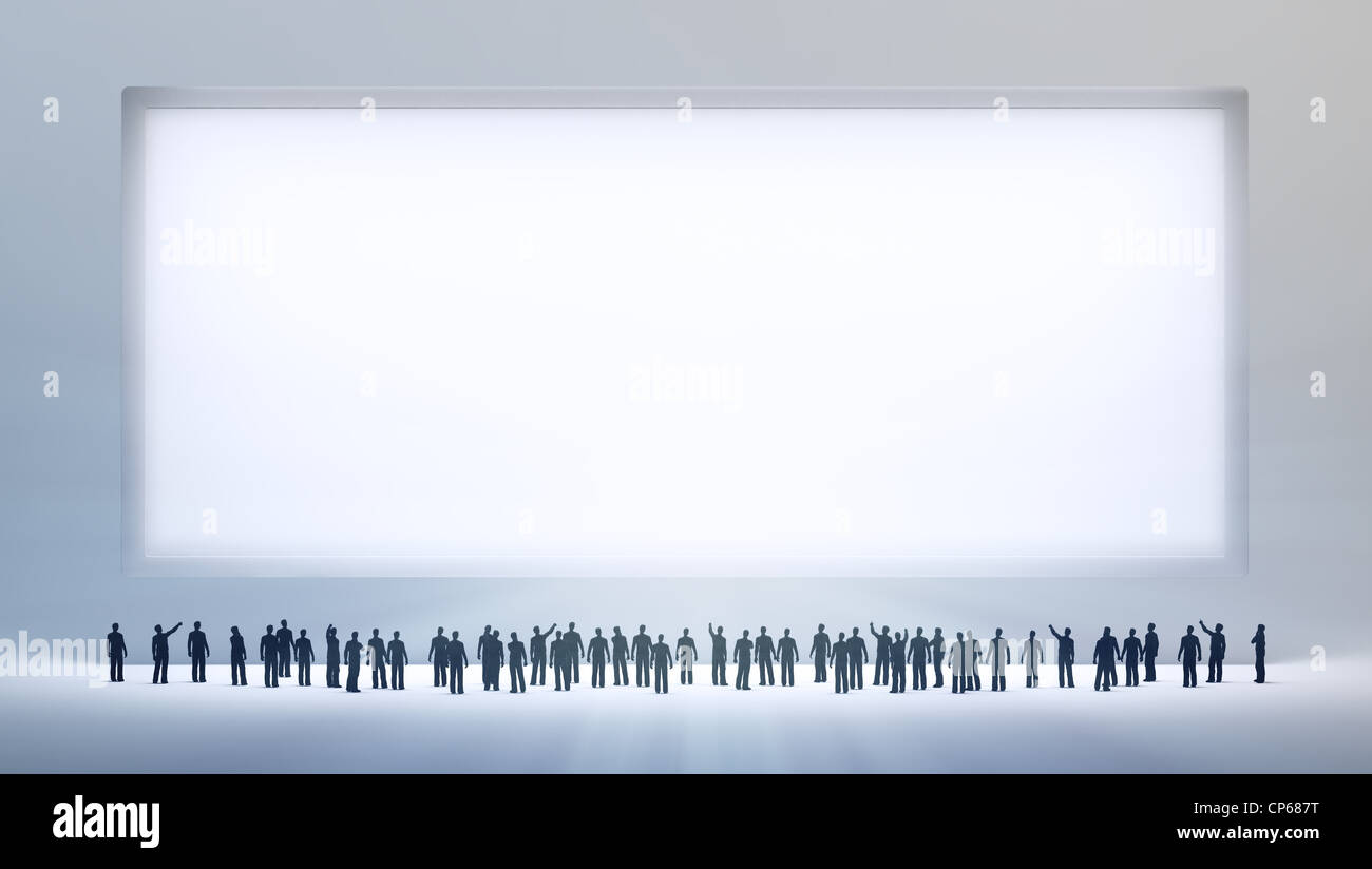 Un petit groupe de personnes regardant un vide ad conseil ou peinture Banque D'Images