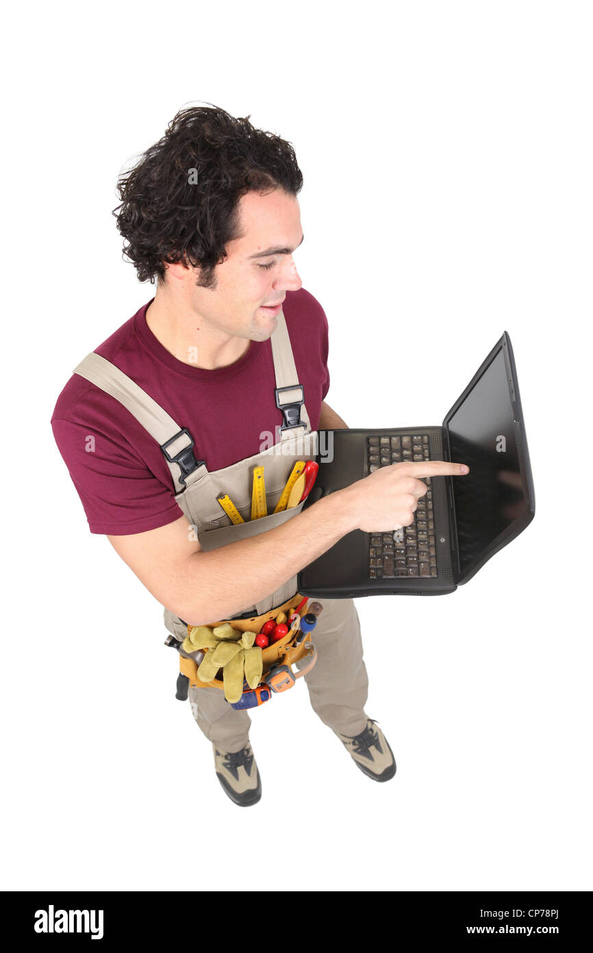 Carpenter avec un ordinateur portable Banque D'Images