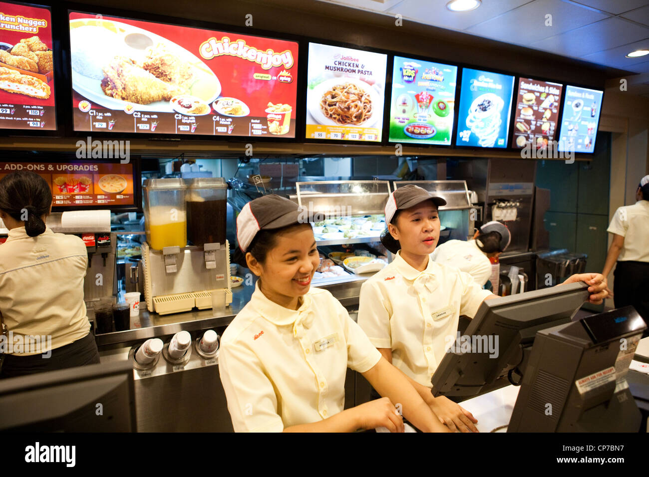 Jollibee caissiers à restauration rapide. La ville de Cebu, Cebu, Visayas, Philippines. Banque D'Images