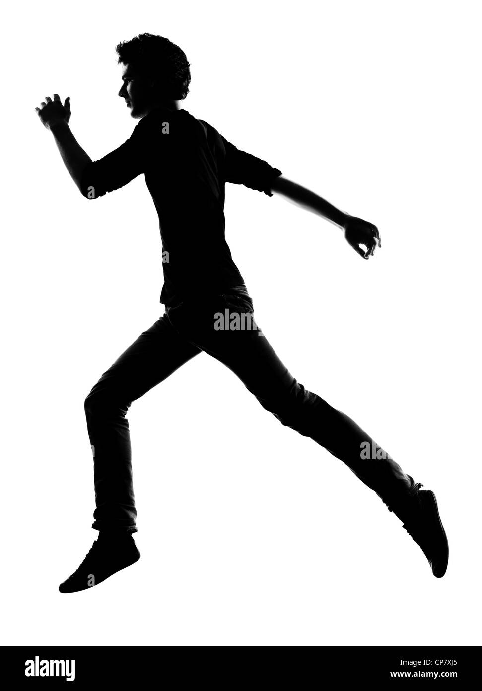 Jeune homme running silhouette en studio isolé sur fond blanc Banque D'Images
