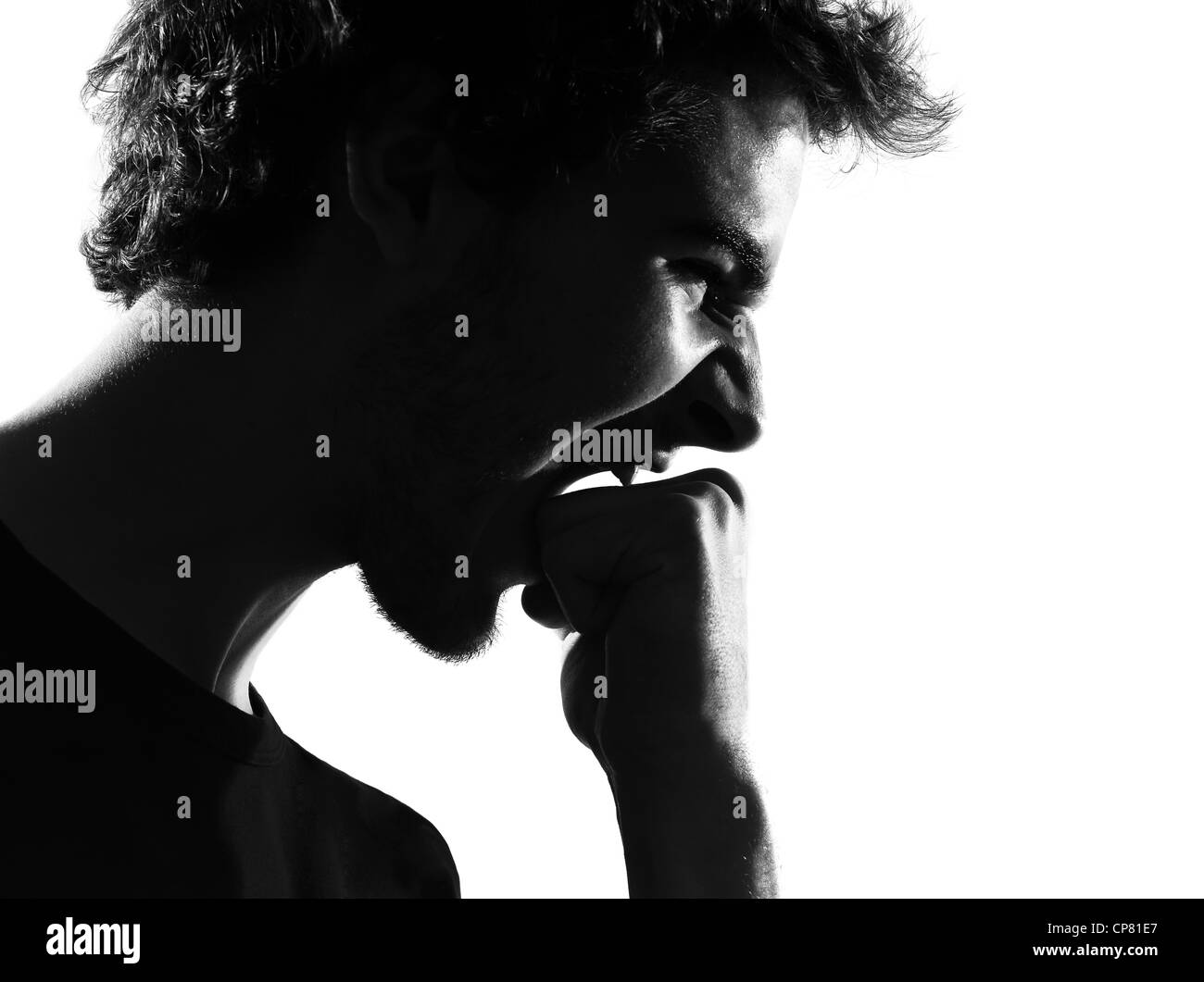 Jeune homme silhouette en studio isolé sur fond blanc Banque D'Images