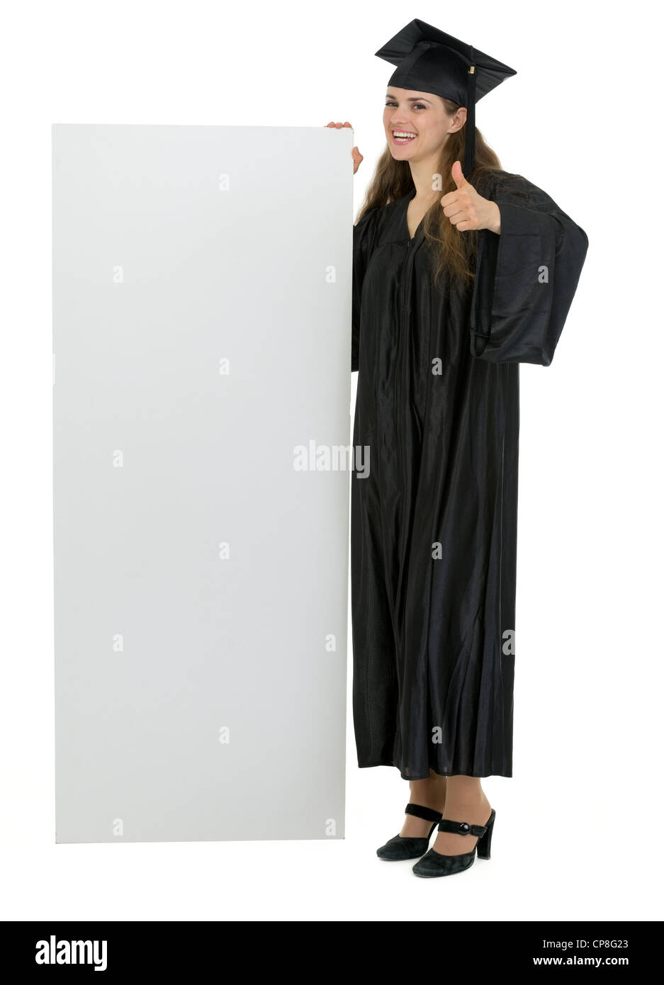 L'obtention du diplôme student holding blank billboard et showing Thumbs up Banque D'Images