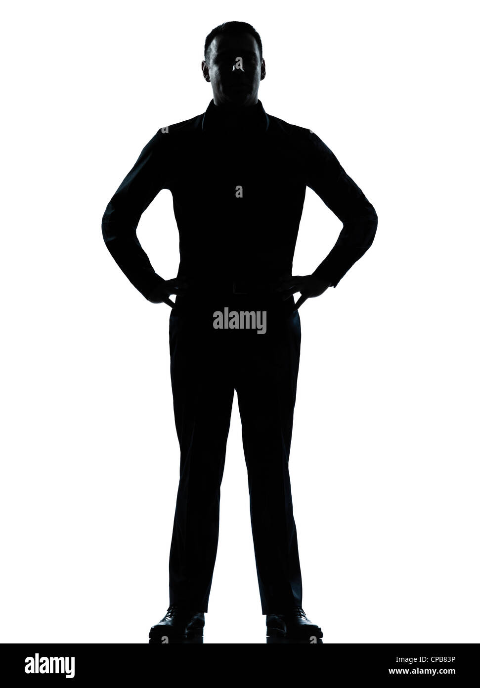 Un caucasian business man silhouette debout les mains sur les hanches en pleine longueur studio isolé sur fond blanc Banque D'Images