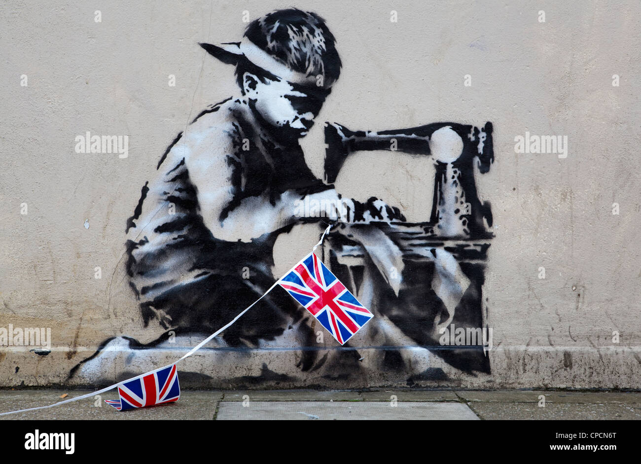 Le travail de la main-d'esclave" de l'artiste graffiti Banksy, London UK Banque D'Images