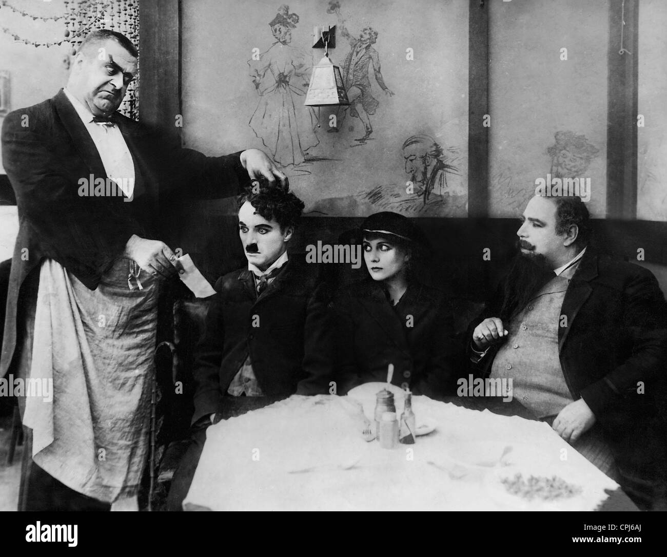 Eric Campbell, Charles Chaplin et Edna Purviance dans 'l'immigré', 1917 Banque D'Images