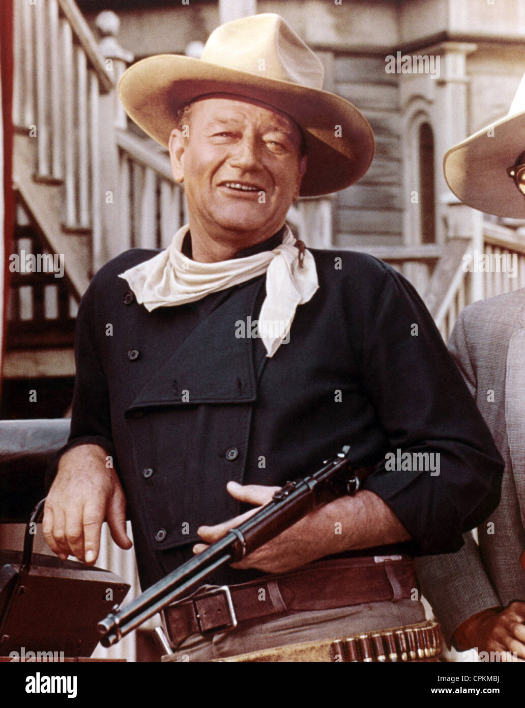 Un portrait de John Wayne avec fusil de cow-boy dans l'ouest de film. Banque D'Images