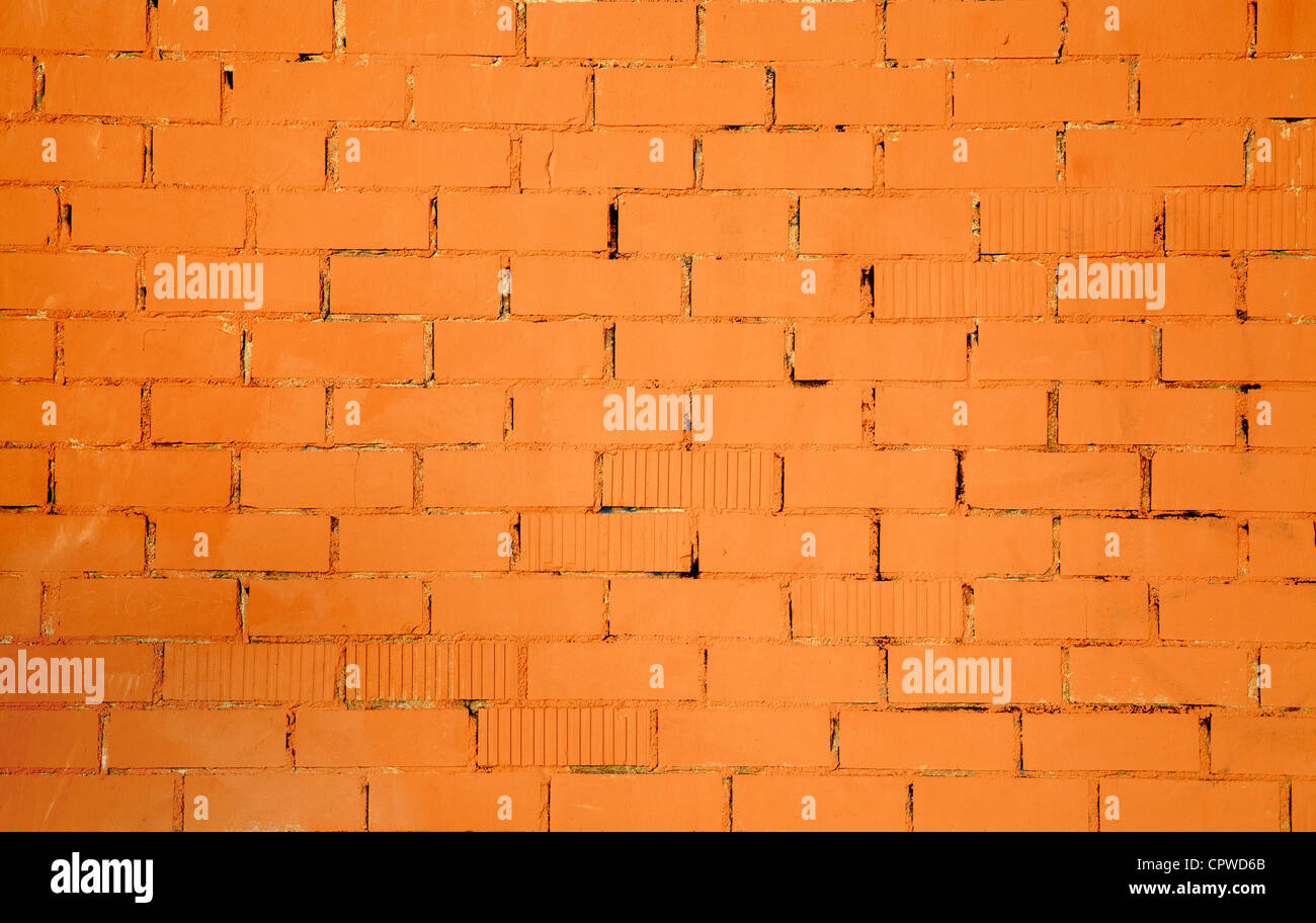 Modèle brickwall texture dans un fond de couleur orange Banque D'Images