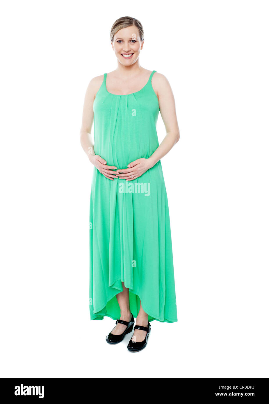Superbe brune femme enceinte habillée comme la princesse en tenue à la mode verte Banque D'Images