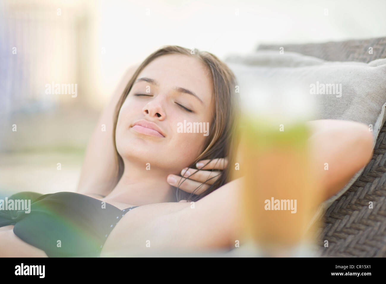Teenage girl sleeping in chaise Photo Stock Alamy