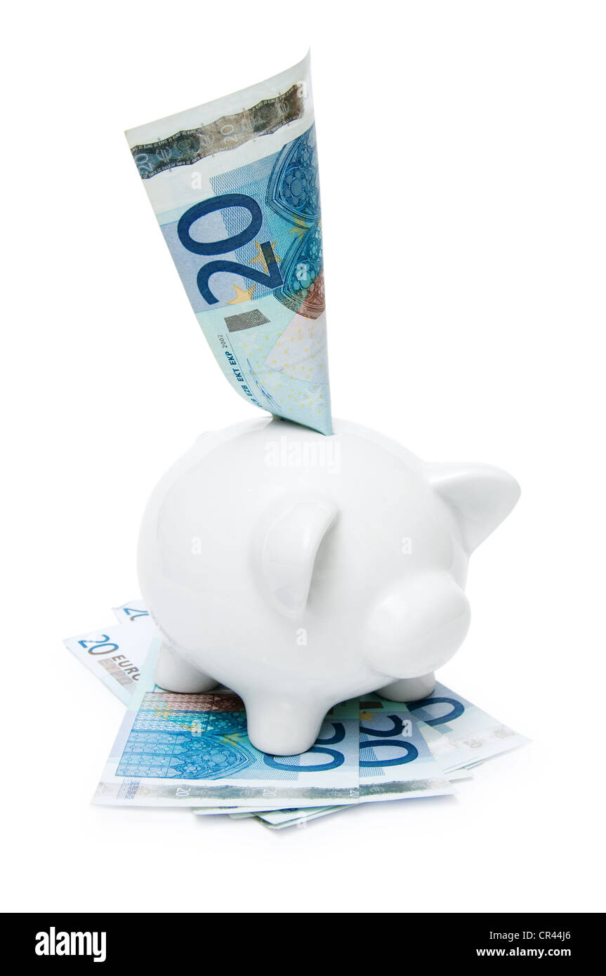 Une petite tirelire avec billets isolé sur fond blanc Banque D'Images