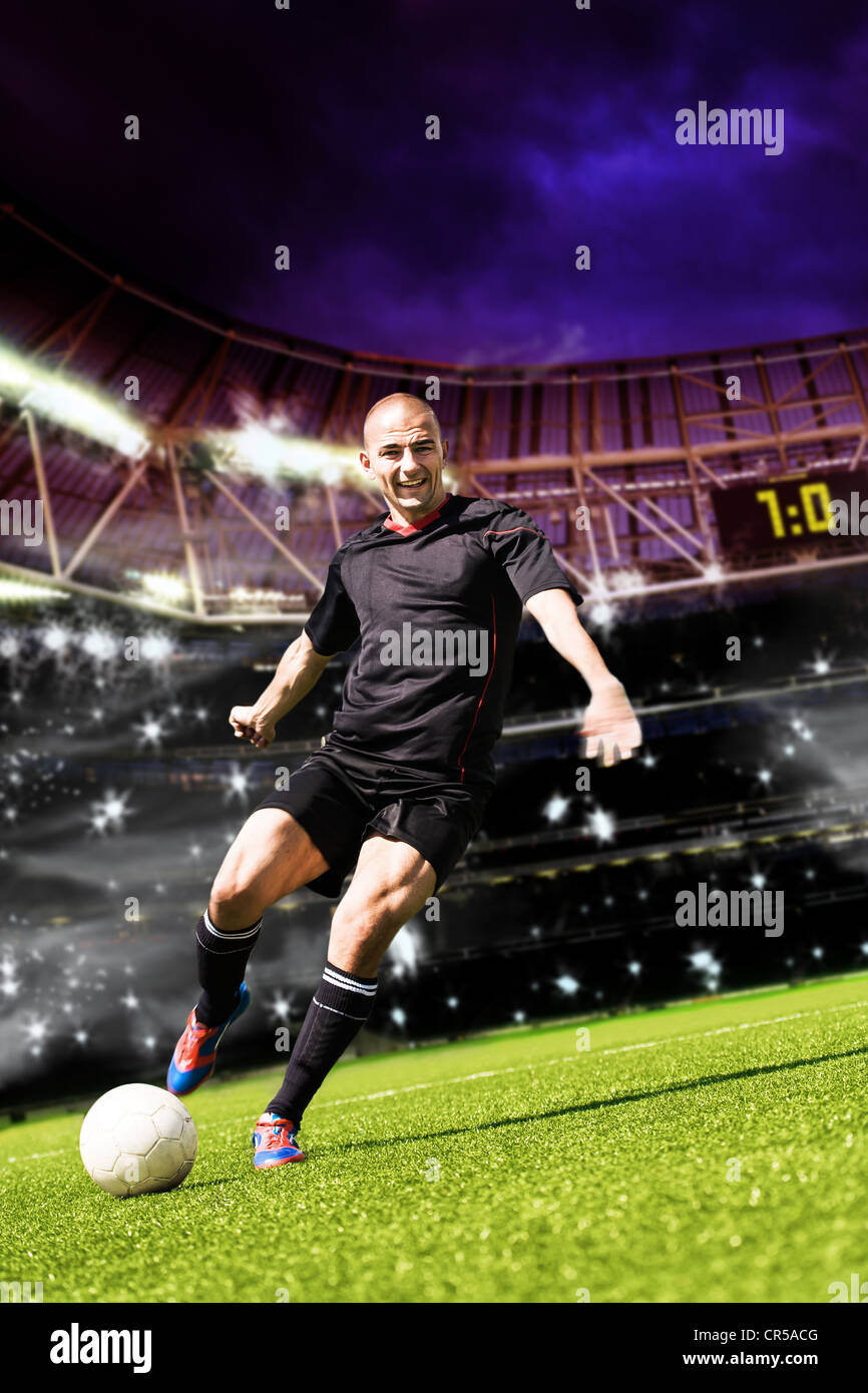 Soccer ou de football player sur le terrain Banque D'Images