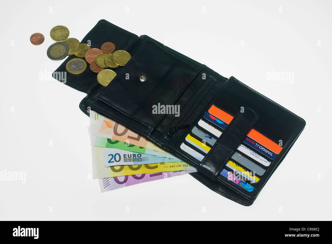 Porte-monnaie ouvert avec billets, pièces de monnaie et des compartiments de carte Banque D'Images