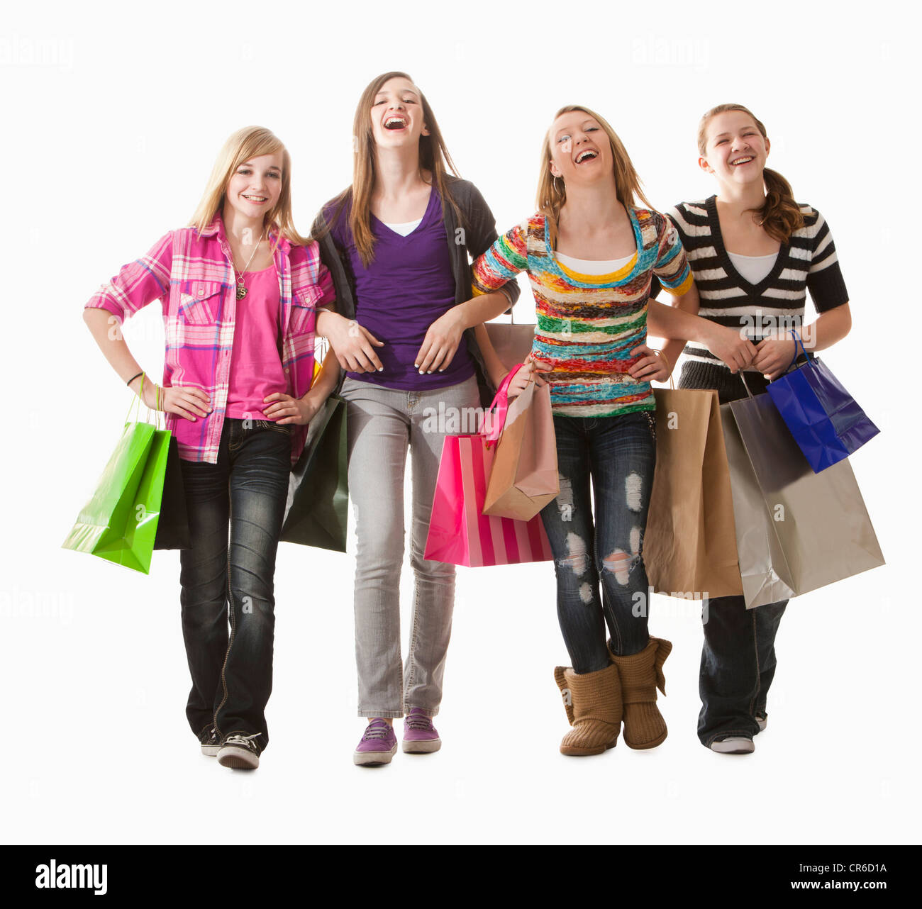 Portrait de quatre professionnels des filles (12-13) with shopping bags Banque D'Images