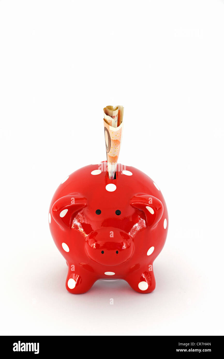 Tirelire rouge à pois blancs et 50 euros Banque D'Images