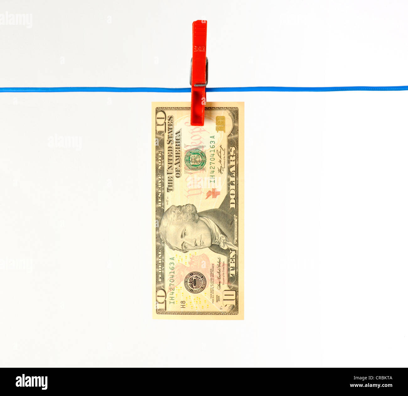 Billets de banque en dollars américains sur une corde, image symbolique pour le blanchiment d'argent sale, Banque D'Images