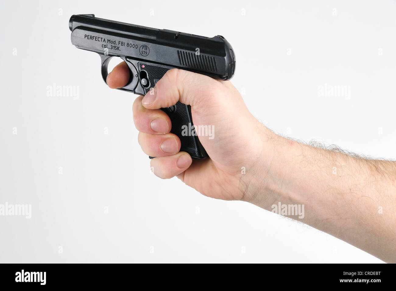 Main tenant un pistolet Photo Stock - Alamy