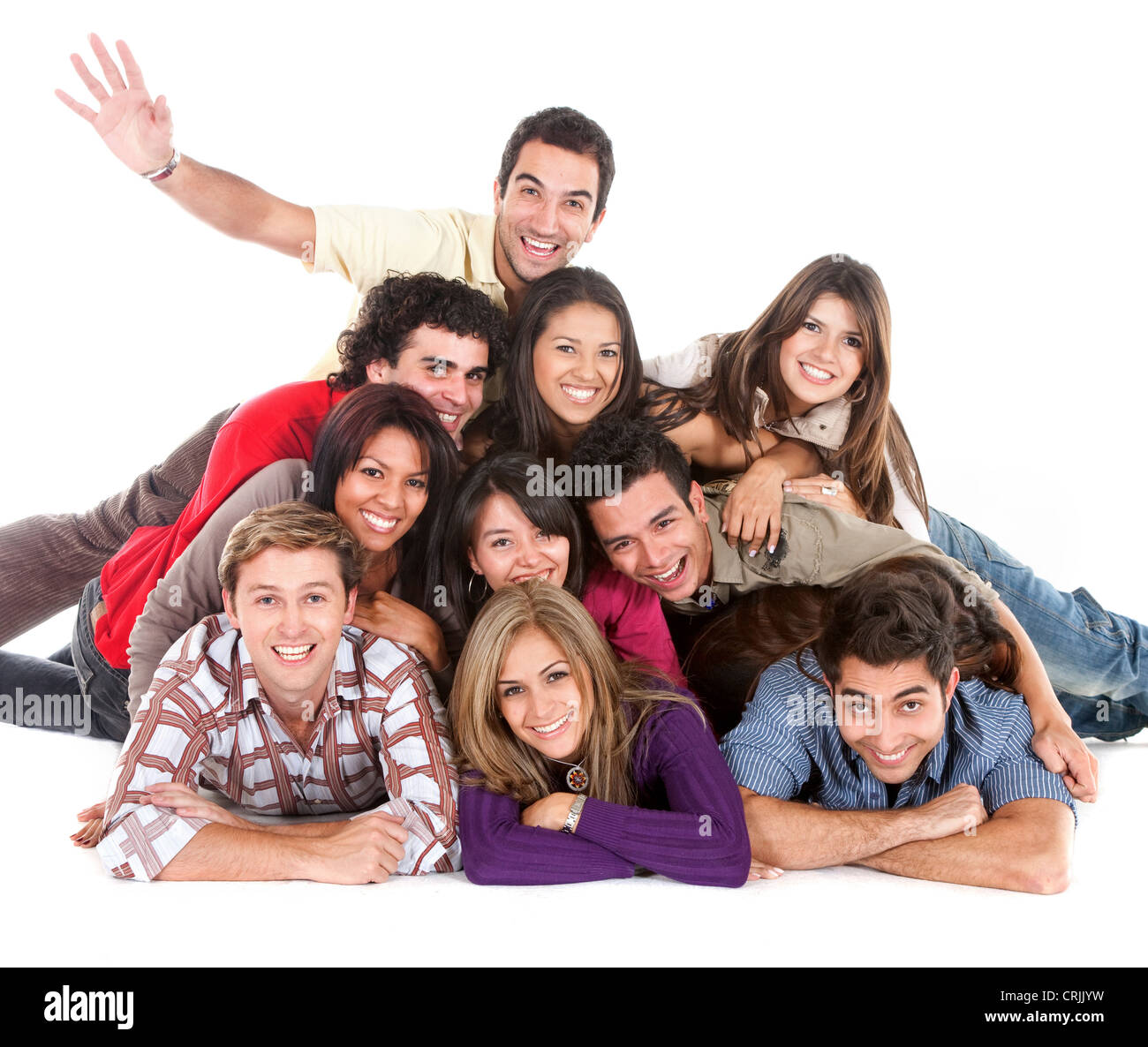 Happy friends avec leurs têtes ensemble sur le plancher isolé Banque D'Images