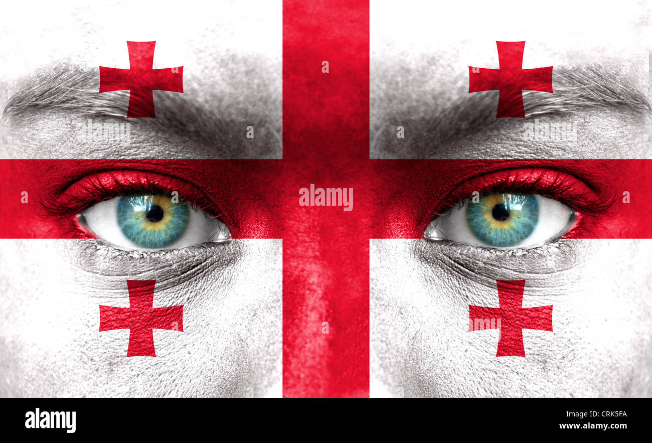 Visage humain peint avec un drapeau de la Géorgie Banque D'Images