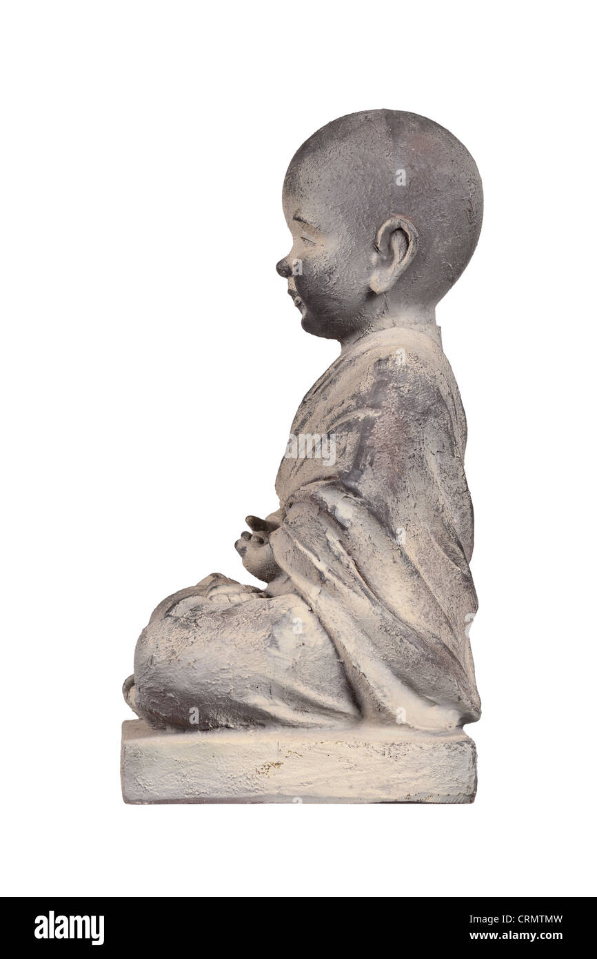 Statuette en pierre d'un bouddha enfant Banque D'Images