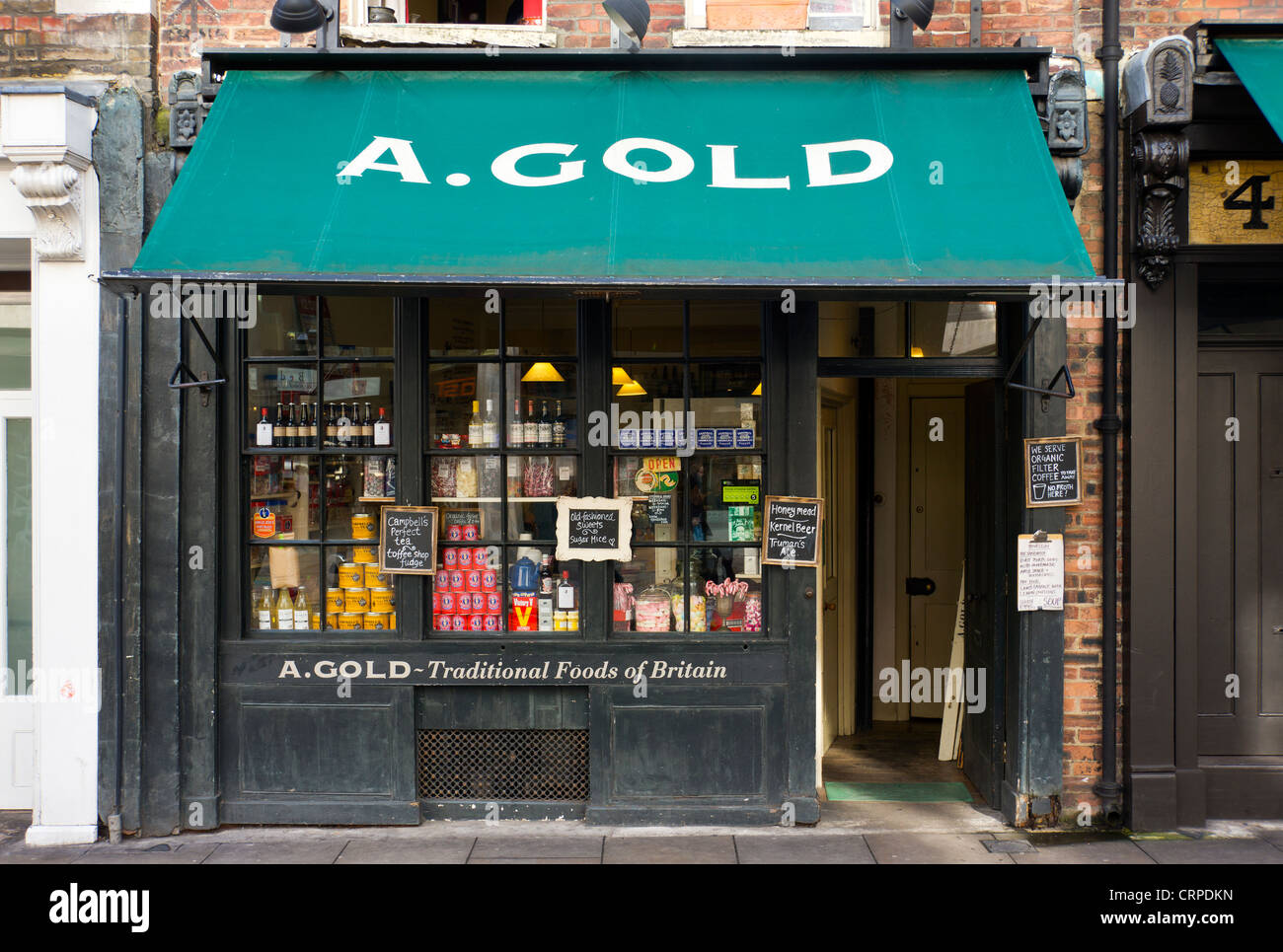 A. L'or, une cuisine britannique traditionnelle shop dans Brushfield Street dans l'East End de Londres. Banque D'Images