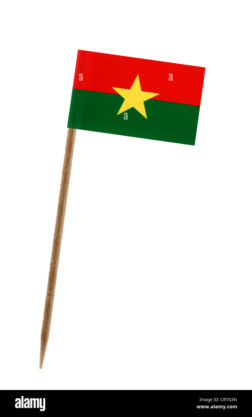 Dent avec un petit drapeau du papier du Burkina Faso Banque D'Images