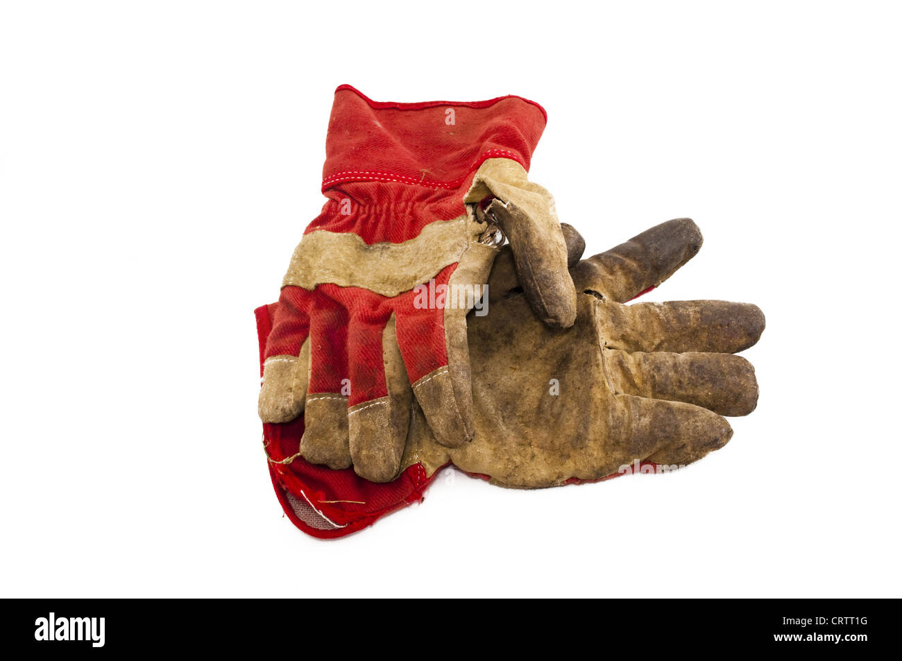 Vieux gants de travail isolé sur fond blanc Banque D'Images