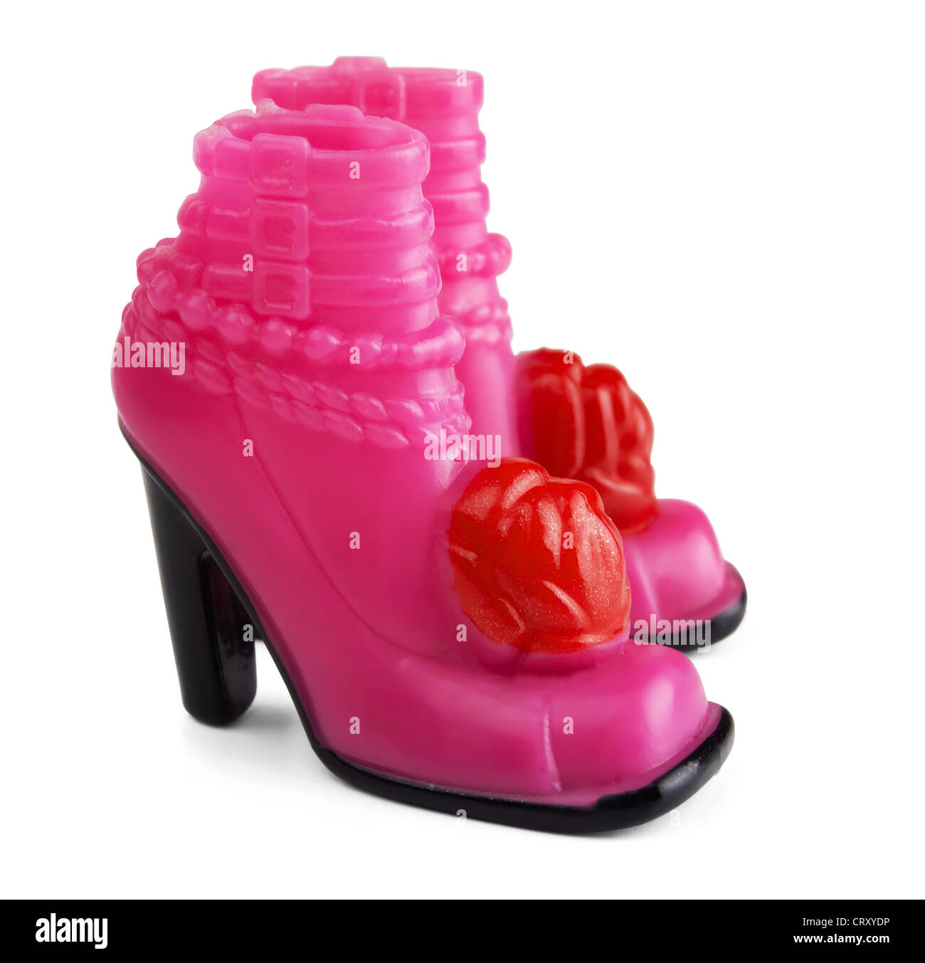 Chaussures de poupée en plastique rose isolated on white Banque D'Images