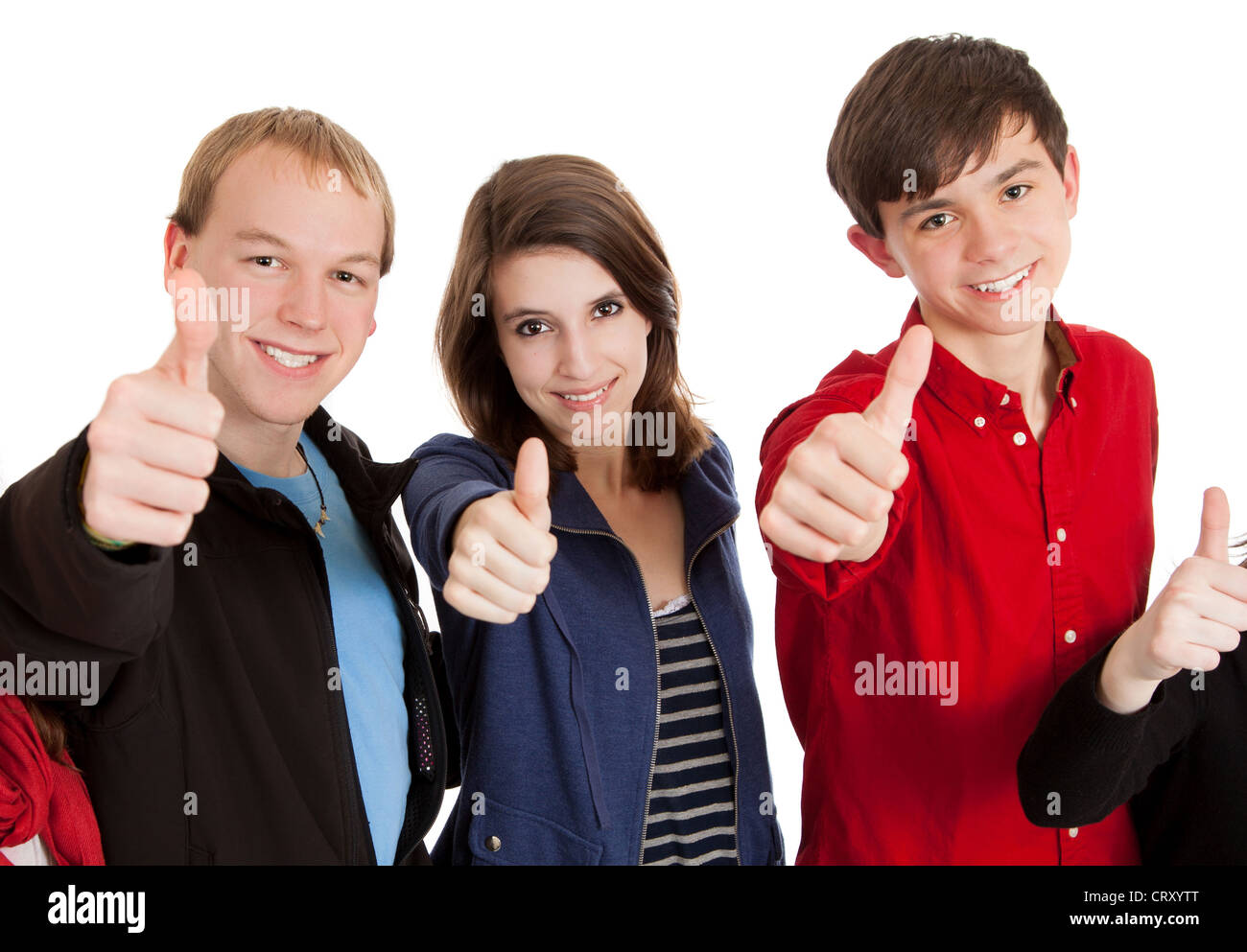 Groupe de trois adolescents avec leurs pouces vers le haut Banque D'Images
