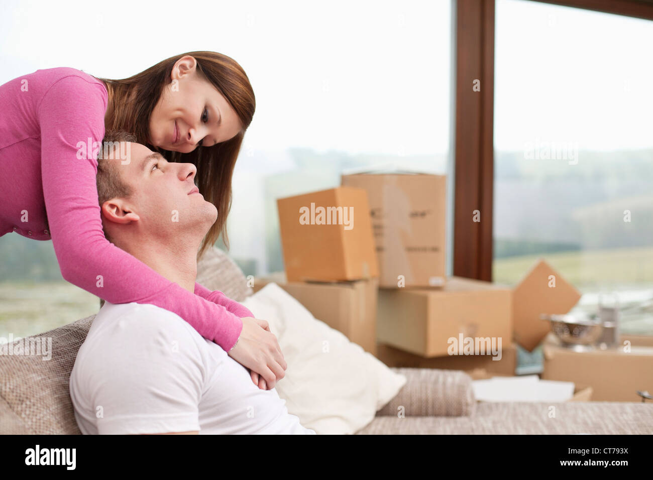 Portrait of young couple in new flat Banque D'Images