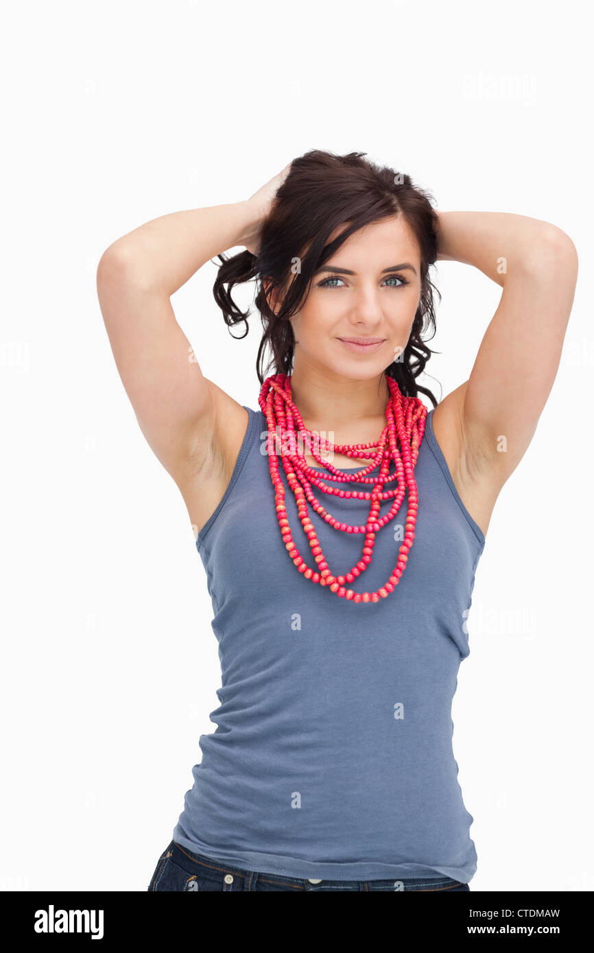Brunette posing with a red bead necklace Banque D'Images
