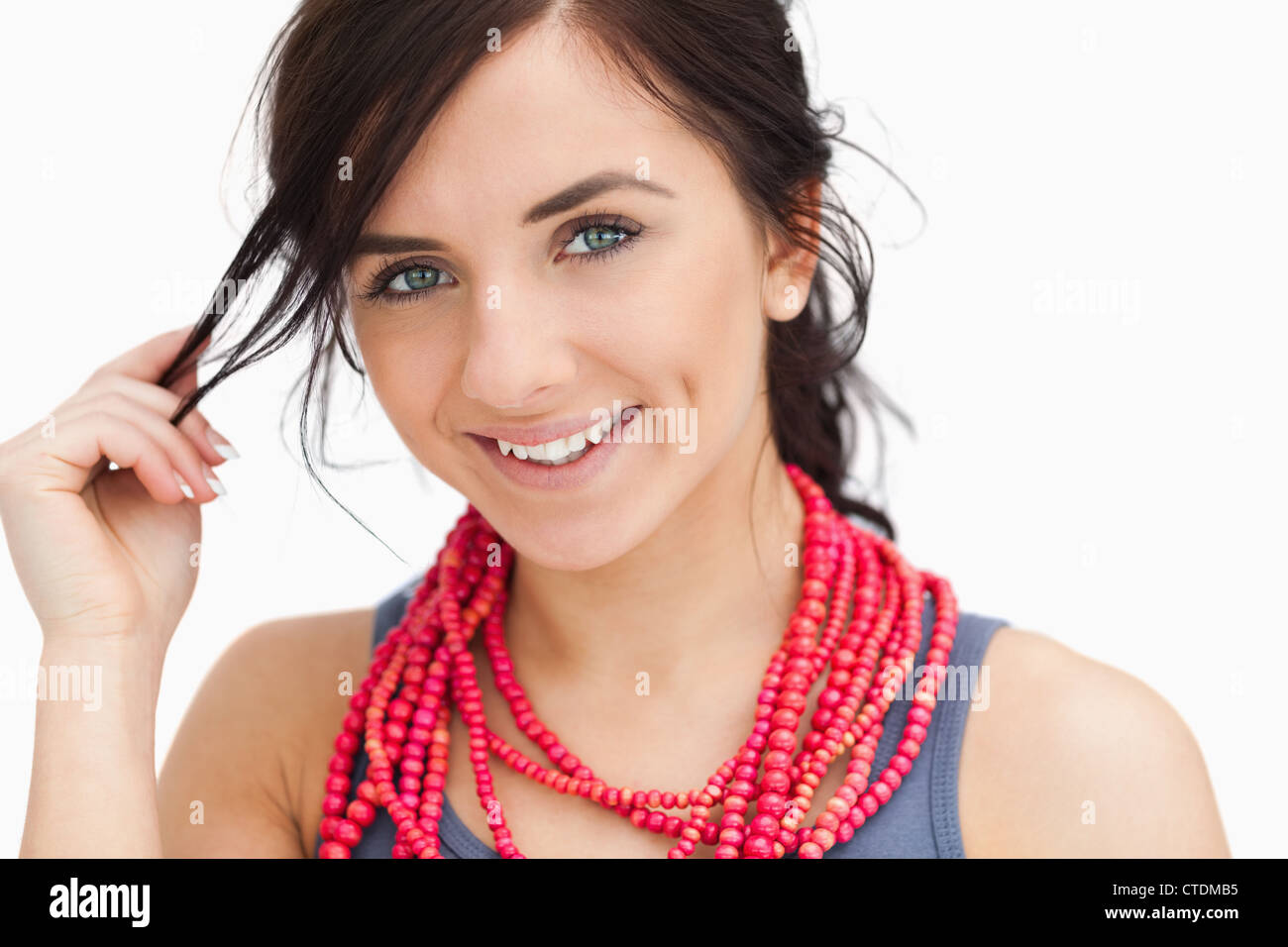 Smiling blue eyed woman with a red bead necklace Banque D'Images