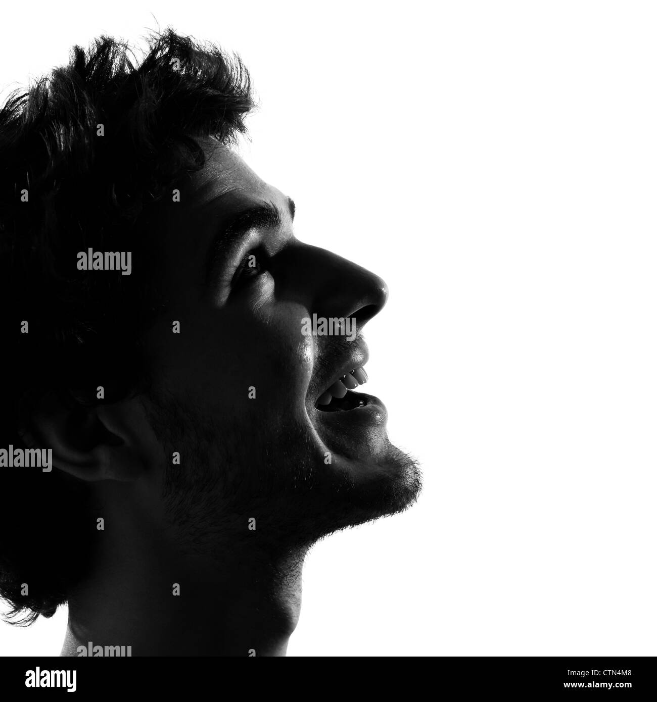Young man looking up smiling happy woman silhouette en studio isolé sur fond blanc Banque D'Images