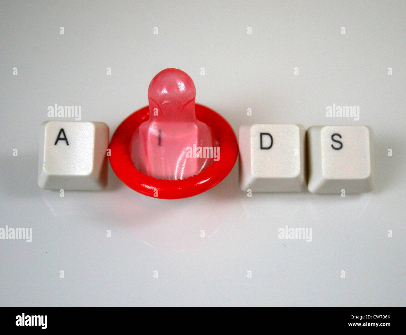 Image symbolique pour la lutte contre le sida, préservatif avec des boutons Banque D'Images